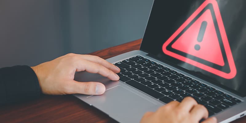 laptop with a warning signal