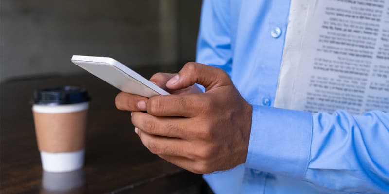 Closeup of man hands using a phone