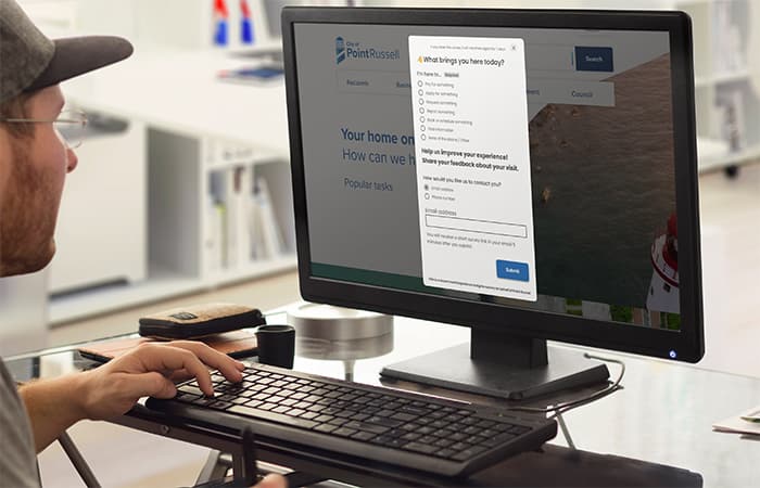 A man filling out a feedback survey on his local government website.