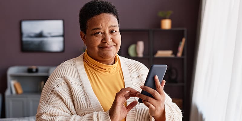 Happy and satisfied citizen interacting with her government through digital channels.