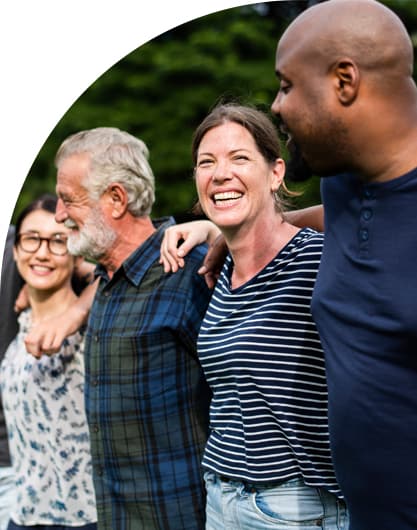 A group of people standing side by side with their arms around each other's shoulders.