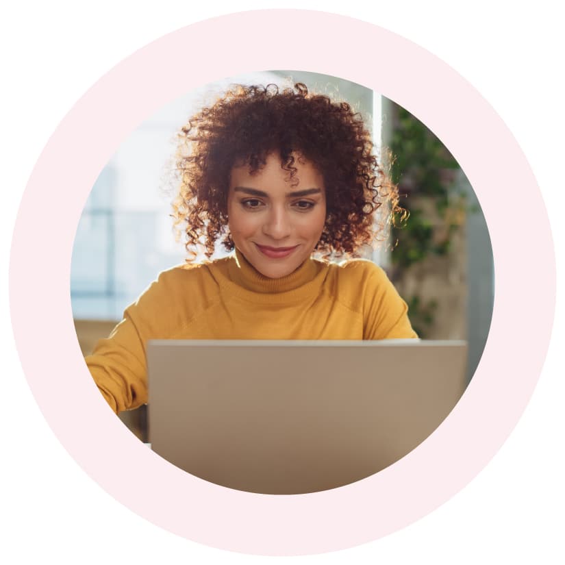 Government program director reviewing data on Granicus’ Government Experience Insights Enterprise dashboard on a laptop.