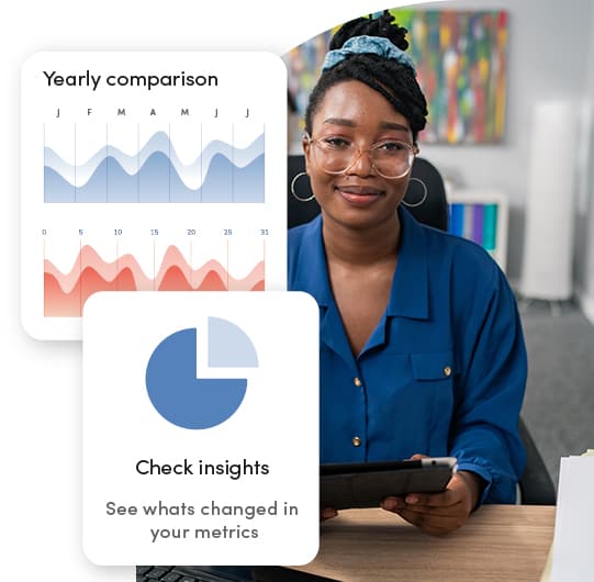 African American government communications analyst reviewing year-over-year data with a GXI Enterprise prompt to explore insights.