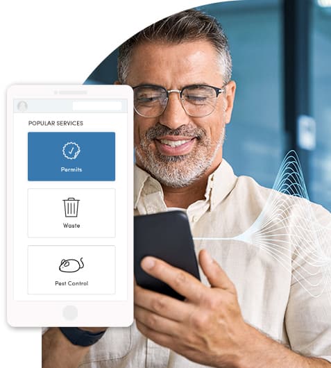 Man at work in the city, using his government's digital self-service portal to request a permit.