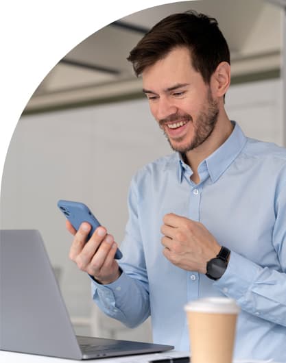 business man working at his desk with a laptop and smartphone